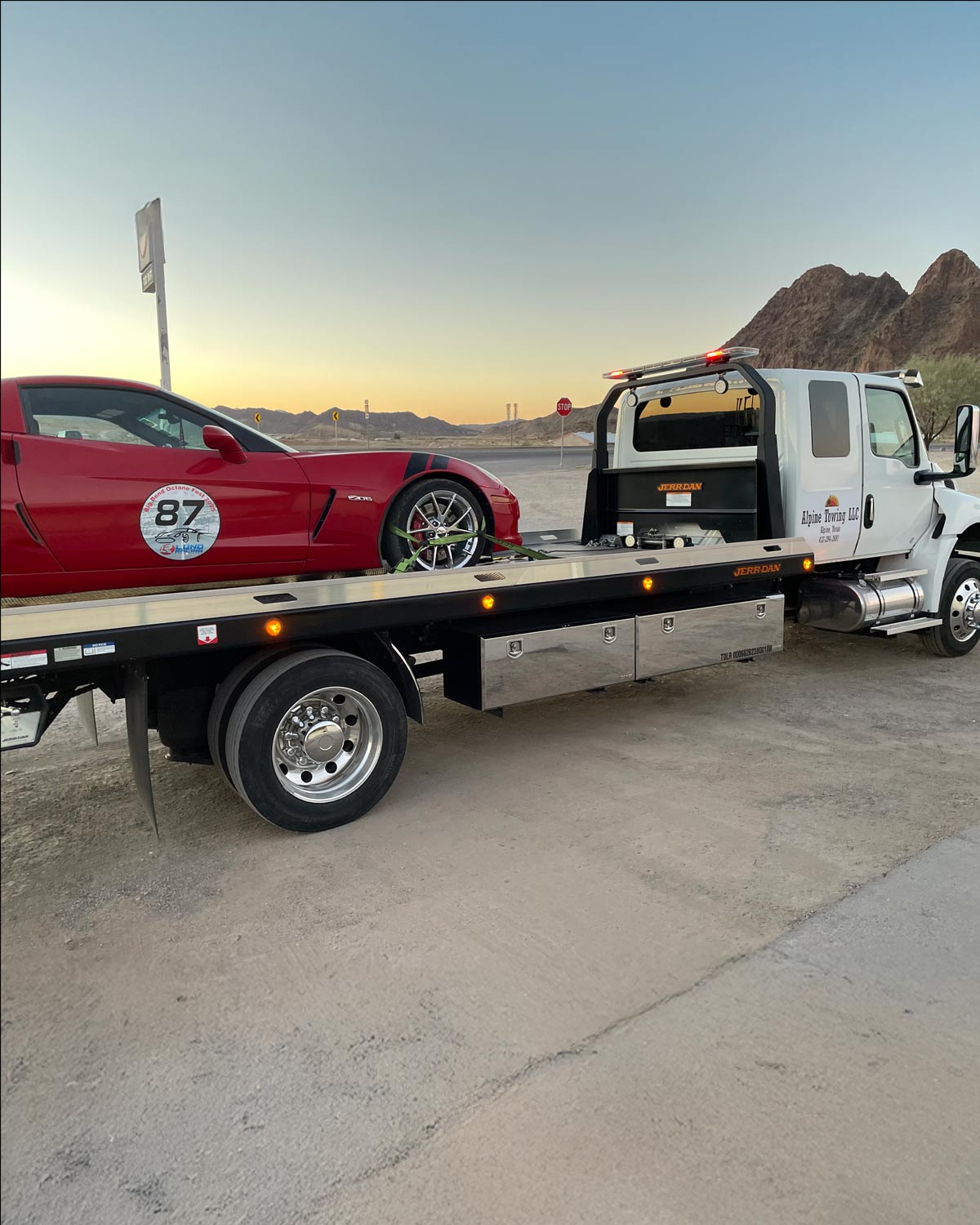 Alpine-Towing-Alpine-Texas-Sports-Car-on-Flatbed-Tow-Truck-With-Mounain-in-distance Alpine Towing Alpine Texas Towing Sports Car on Flatbed With Mountain in Distance